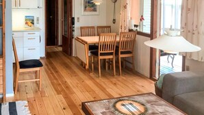 A compact living space with a dining area, a kitchen, and a sofa. - 5 Person Holiday Home in Odder-by Traum (Odder)