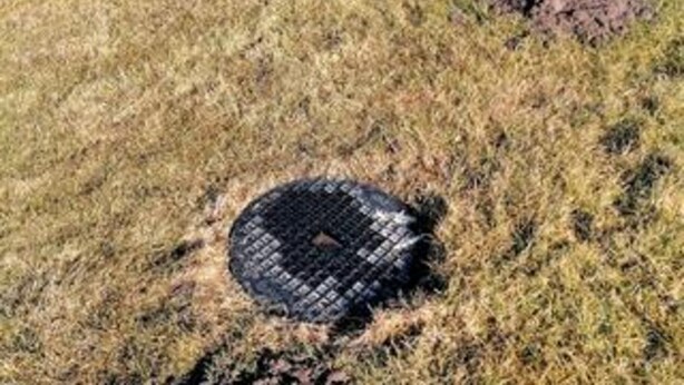 A manhole cover in a grassy area. - 4 Star Holiday Home in Lokken (Lokken)