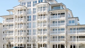 A multi-story hotel with balconies and large windows. - Holiday Home in Grossenbrode (Grossenbrode)