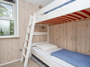 A bunk bed with a ladder, a window, and a view of greenery outside. - 8 Person Holiday Home in Struer (Struer)