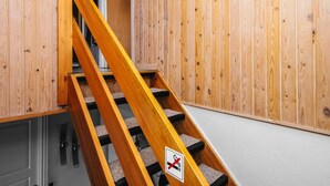 A wooden staircase with a no-smoking sign. - 3 Person Holiday Home in Ansager (Ansager)