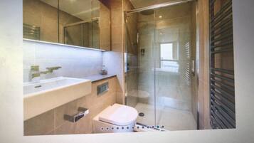 Combined shower/bathtub, hair dryer, towels, soap