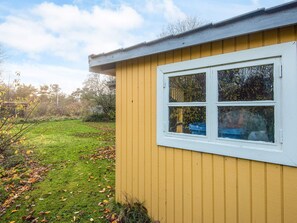 A yellow building with a white window. - Reposeful Holiday Home in Skjern near Sea (Skjern)