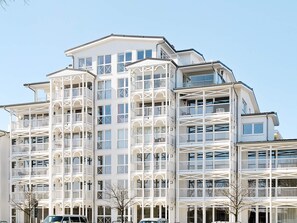 A multi-story building with balconies and large windows. - Holiday Home in Grossenbrode (Grossenbrode)
