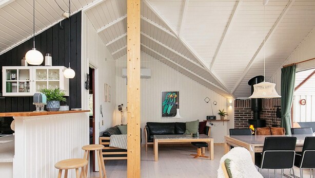 A modern interior with a kitchen, dining area, and living space.