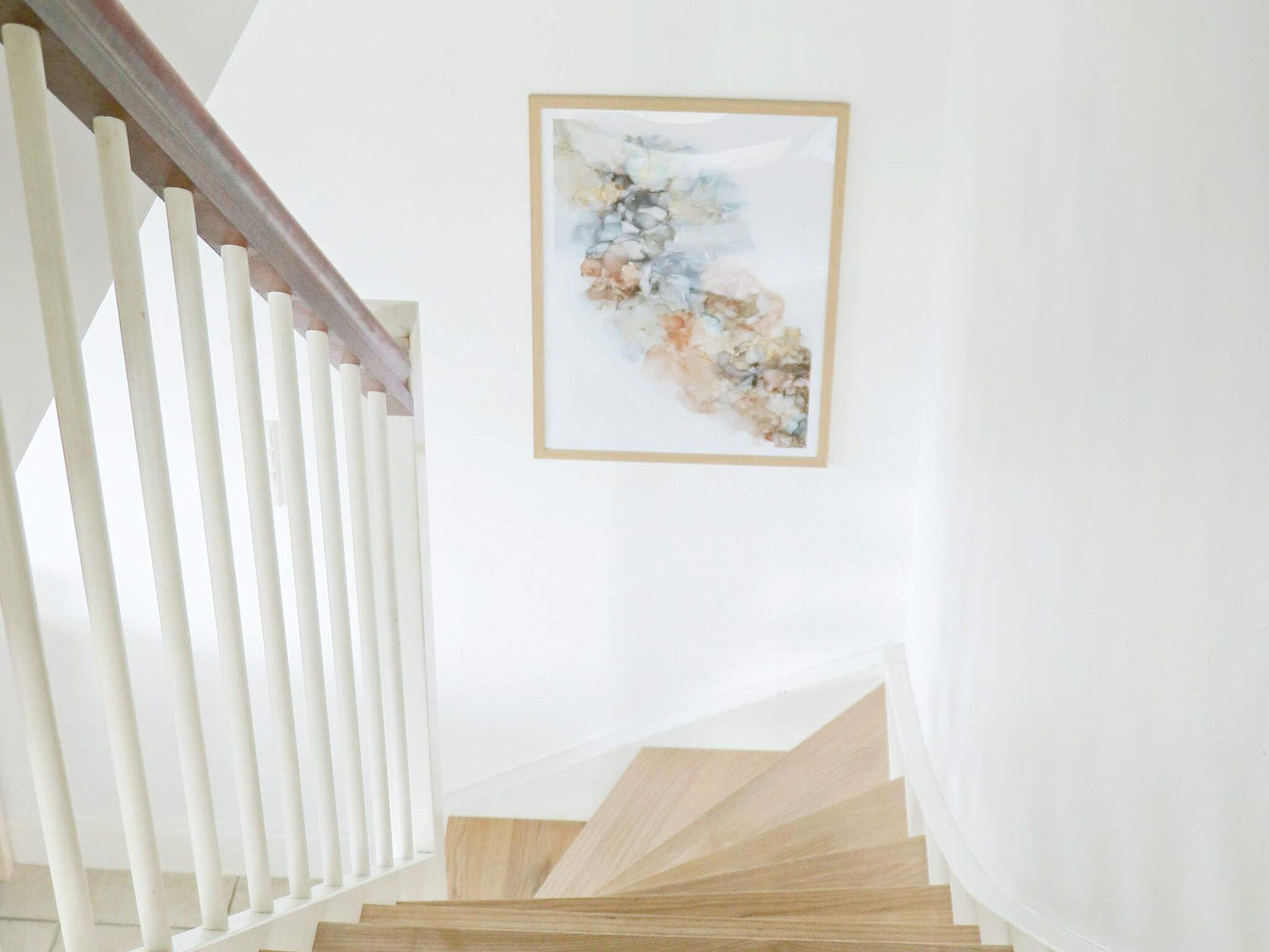 A staircase with white railings and wooden steps.