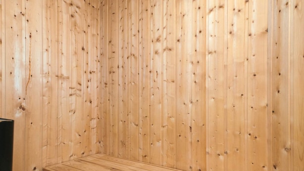 A wooden sauna with a bench. - Pleasing Holiday Home in Ebeltoft near Sea (Ebeltoft)