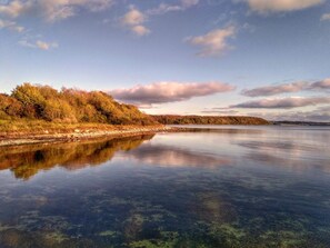 A calm river with clear water reflecting the sky and surrounding trees. - 7 Person Holiday Home in Kolind-by Traum (Kolind)