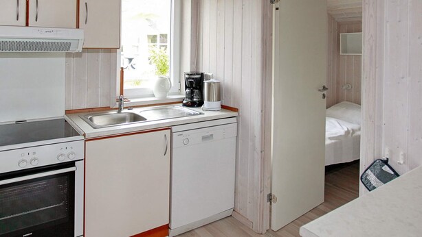 A compact kitchen with a Siemens oven, a coffee maker, and a sink. - Holiday Home in Gelting (Gelting)