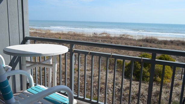 A balcony with a view of the beach and ocean. - A Place at the Beach II 2H - Ocean Front in Garden City Beach (Garden City)