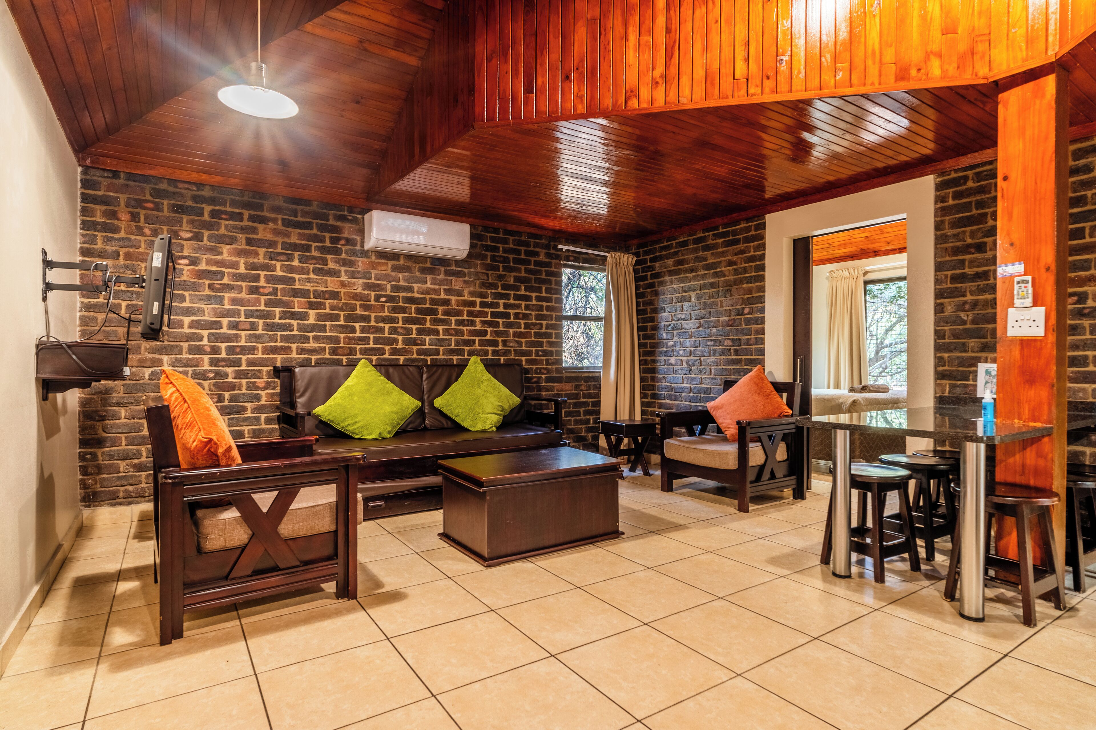 6 sleeper mountain cabin 3* (wheelchair) (11) | living area | 32-inch tv with satellite channels, ping pong