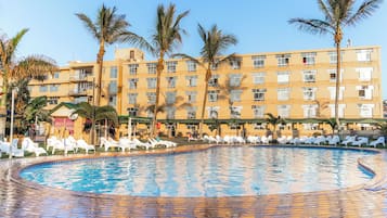 Outdoor pool, pool loungers, lifeguards on site