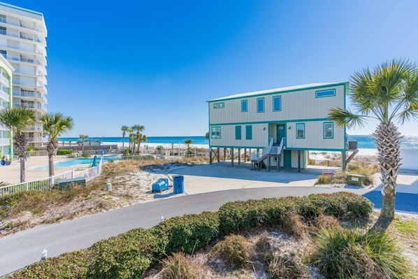 A beachfront hotel with a pool, palm trees, and a clear view of the ocean. - Seascape 111 - Everyone Needs a Beach Break! Make Your Dreams a Reality (Orange Beach)
