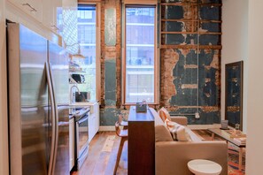 Loft 201 | Living area | 38-inch flat-screen TV with cable channels, TV - 506 Lofts - Anchor Rentals (Nashville)