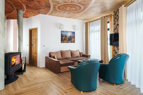 Studio Suite | Living area | Flat-screen TV, heated floors