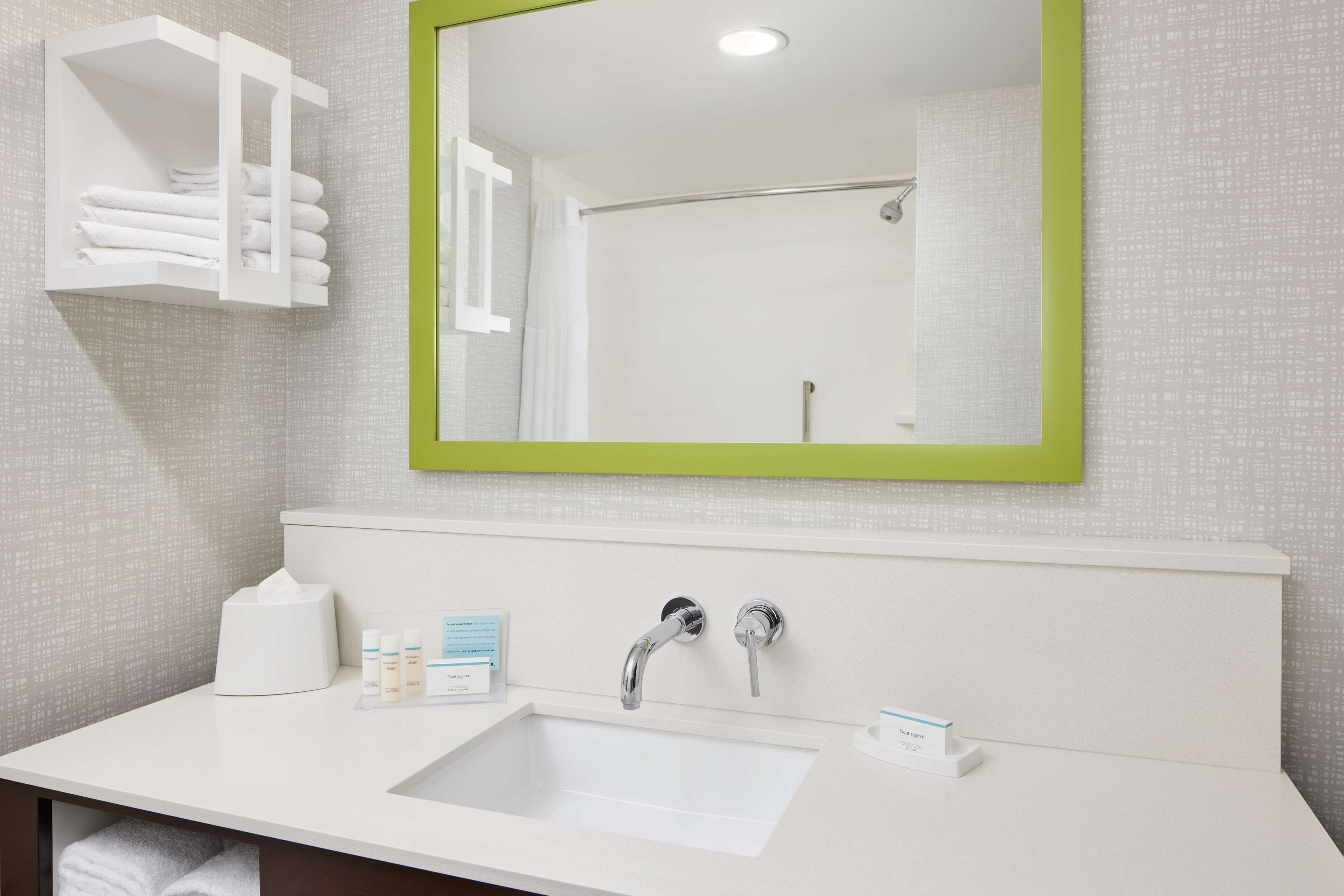 combined shower/bathtub, towels, soap, toilet paper