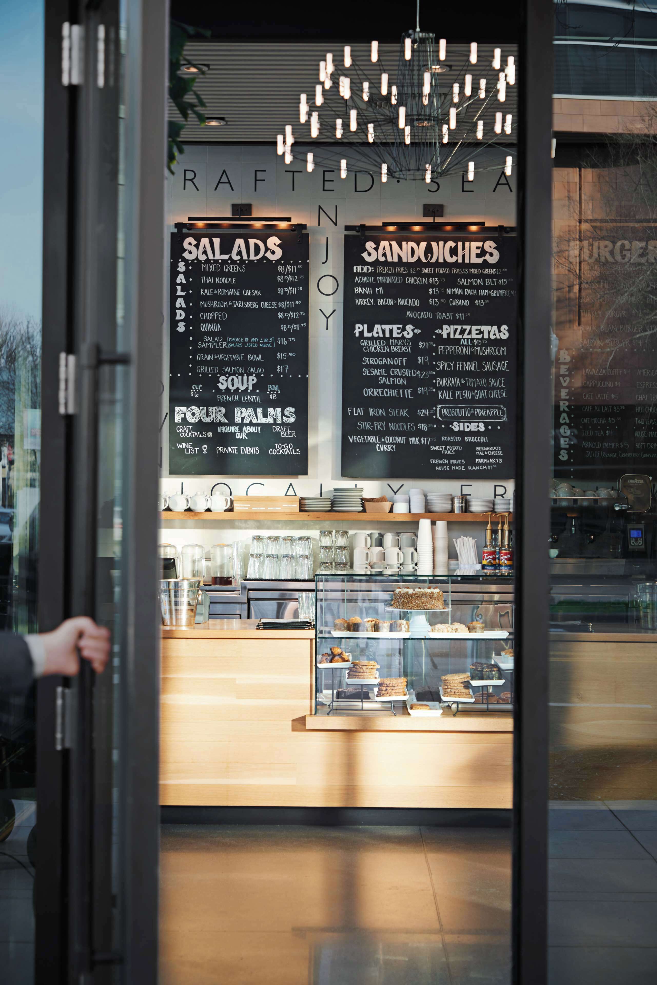 A restaurant menu board with various food options and prices.