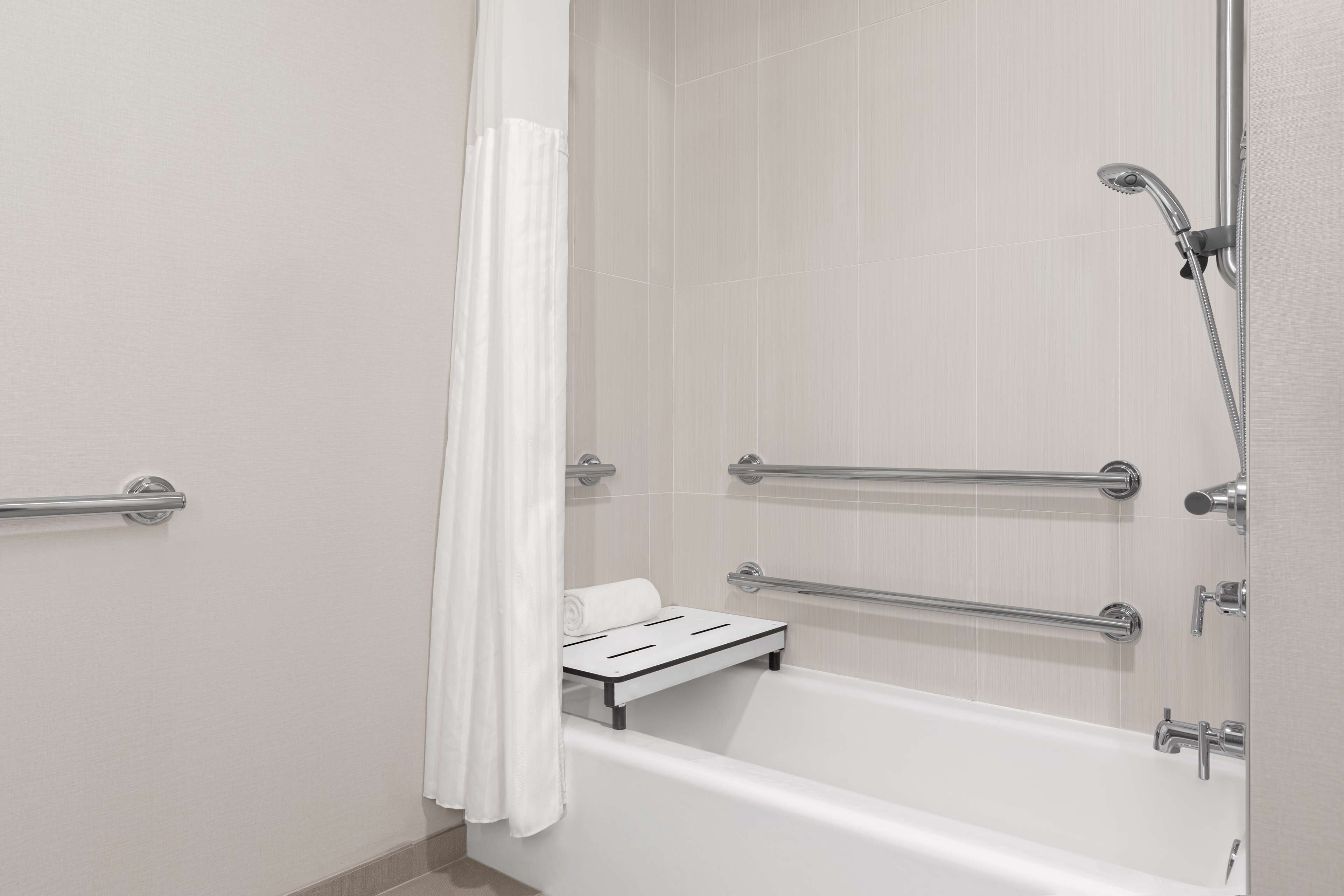 designer toiletries, hair dryer, towels, soap