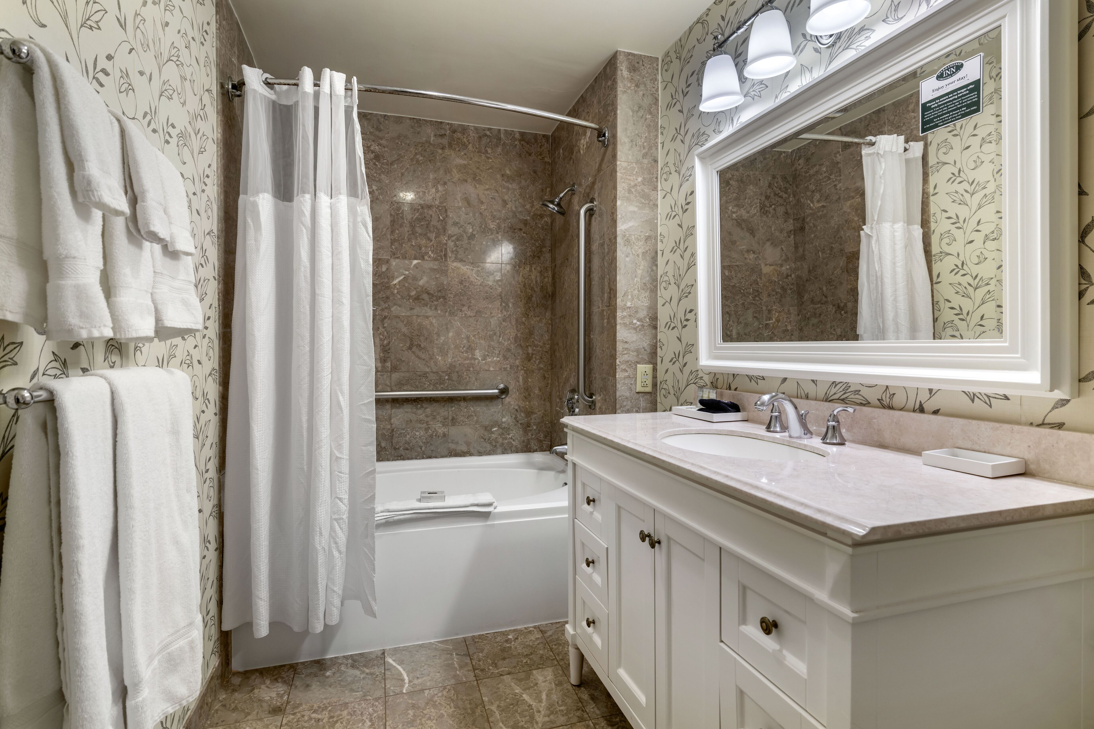 deluxe room, 1 king bed | bathroom | free toiletries, hair dryer, bathrobes, towels