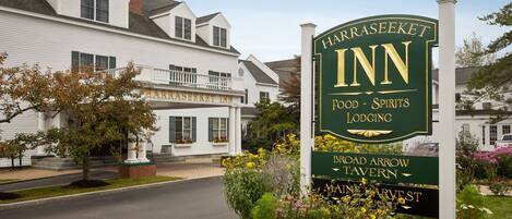 A sign for Harraseeket Inn, indicating it offers food, spirits, and lodging.
