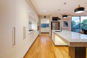 Coffee/tea maker, fridge, microwave, oven