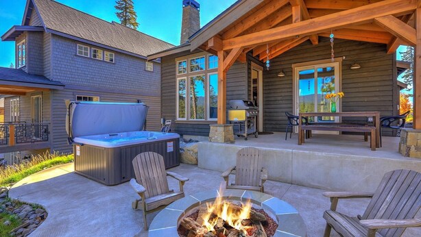 A patio area with a hot tub, outdoor seating, and a fire pit. - Family Retreat w/ Suncadia Pool Access (Cle Elum)