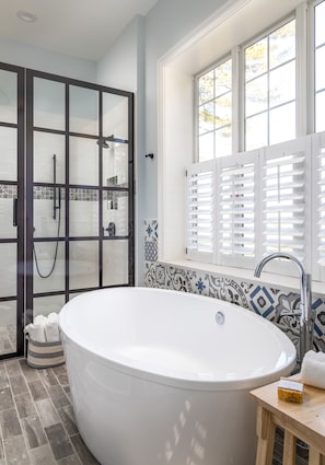 Bathtub, hair dryer, towels, soap