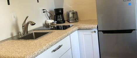 Fridge, microwave, coffee/tea maker, toaster