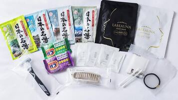 A variety of personal care products including face masks, hairbrushes, and cotton sets.