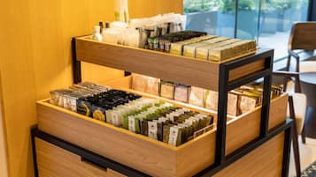A wooden display with neatly arranged tea bags and other items.