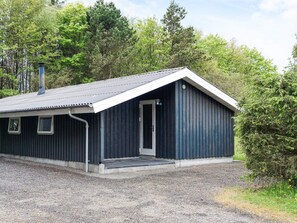 A small, single-story building with a sloped roof, a door, and a small porch area. - 4 Star Holiday Home in Fjerritslev (Fjerritslev)