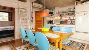 A compact kitchen with white cabinets, a microwave, and a refrigerator. - 6 Person Holiday Home in Roslev (Roslev)