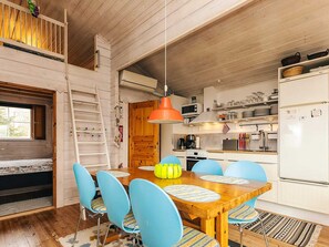 A compact kitchen with white cabinets, a microwave, and a refrigerator. - 6 Person Holiday Home in Roslev (Roslev)