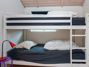 A bunk bed with a window above the lower bunk. - 4 Star Holiday Home in Haderslev (Haderslev)