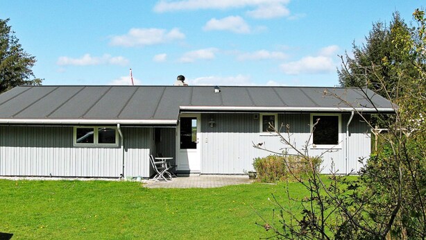 A single-story building with a flat roof, a front door, and a small porch area. - Spacious Holiday Home in Højslev near Sea (Hojslev)