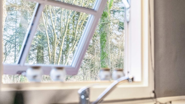 A window with a view of trees outside. - 4 Person Holiday Home in Skaerbaek (Skaerbaek)