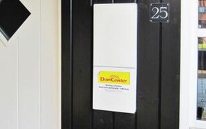 A door with a sign indicating 'DanCenter' and the number '25' above it. - 5 Star Holiday Home in Juelsminde (Juelsminde)