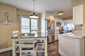 Enjoy meals in the central island kitchen with a dining table for two.