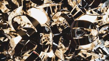 A close-up of a metallic sculpture with reflective surfaces and intricate details.