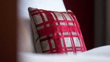 A close-up of a pillow with a geometric pattern.
