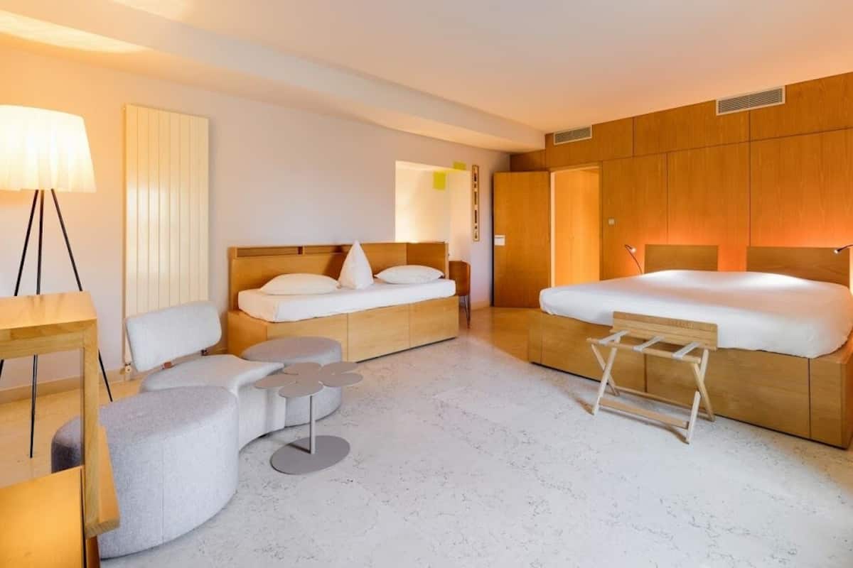 Junior Triple Room | Minibar, in-room safe, individually decorated, individually furnished