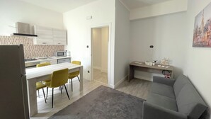 A modern apartment with a kitchen, dining area, and a living room. - At the sight of the Baroque  (Lecce)