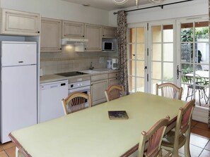 Microwave, dishwasher, high chair, dining tables