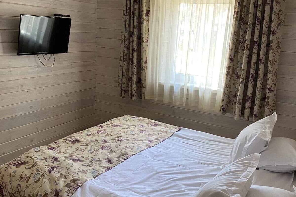 Premium bedding, desk, laptop workspace, blackout curtains