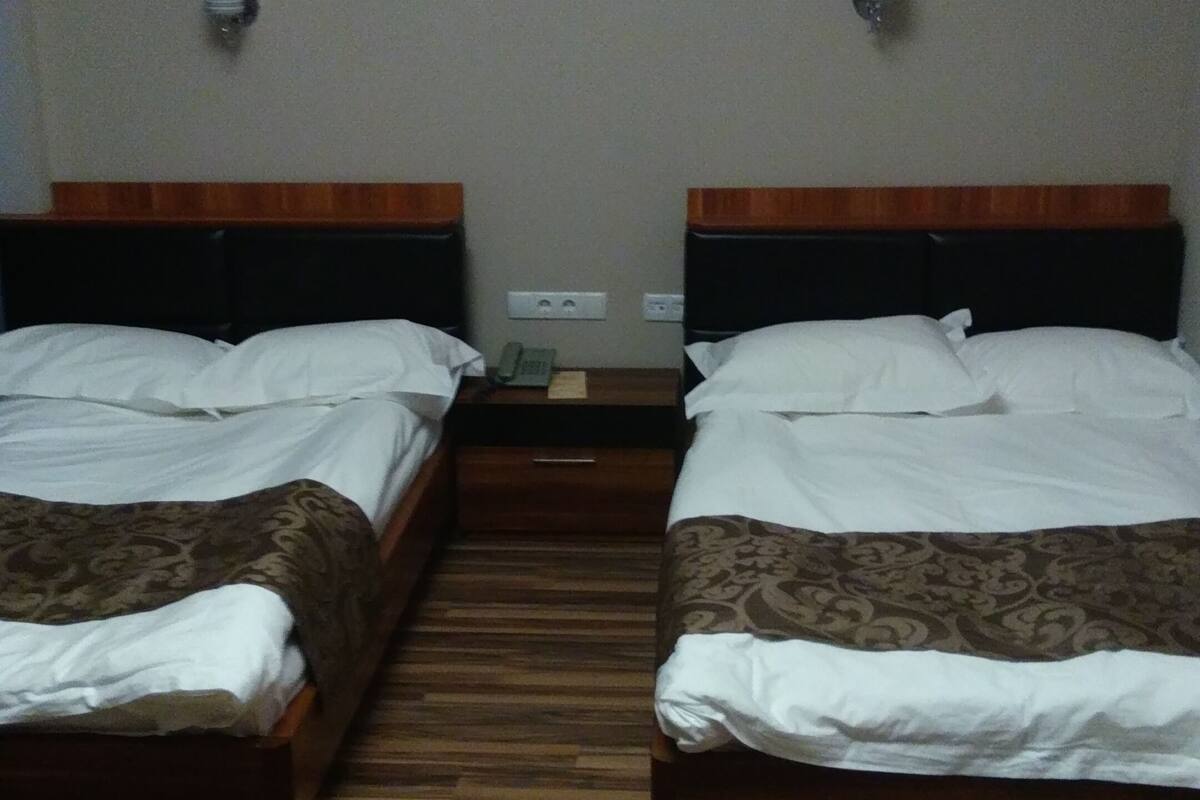 Premium bedding, desk, laptop workspace, blackout curtains