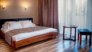 Premium bedding, desk, laptop workspace, blackout curtains