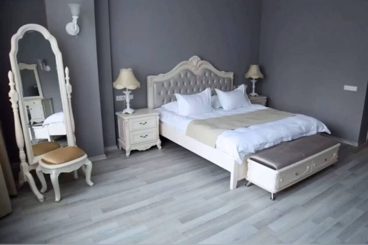 Premium bedding, desk, laptop workspace, blackout curtains