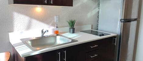 Fridge, microwave, stovetop, coffee/tea maker