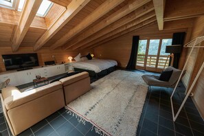 Quarto casal superior | Área de estar