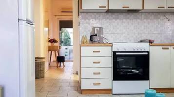 Comfort Apartment, 1 Bedroom, Sea View, Garden Area | Private kitchen | Full-sized fridge, oven, stovetop, coffee/tea maker